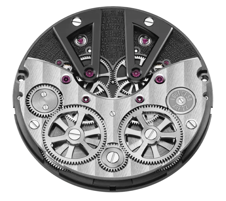 Dial-side view of calibre ARF22 showing the twin balance systems at the top, double barrels and visible gear train on a dark main plate.
